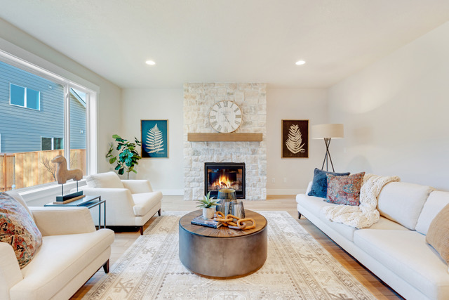 See how we highlighted the fireplace in this transitional style home staging