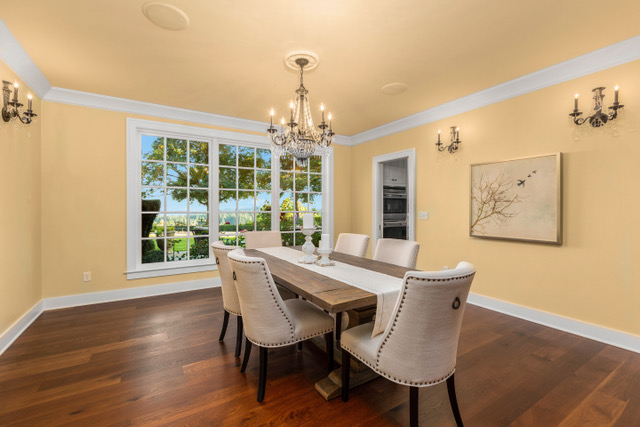 The staged formal dining room with views of downtown Portland